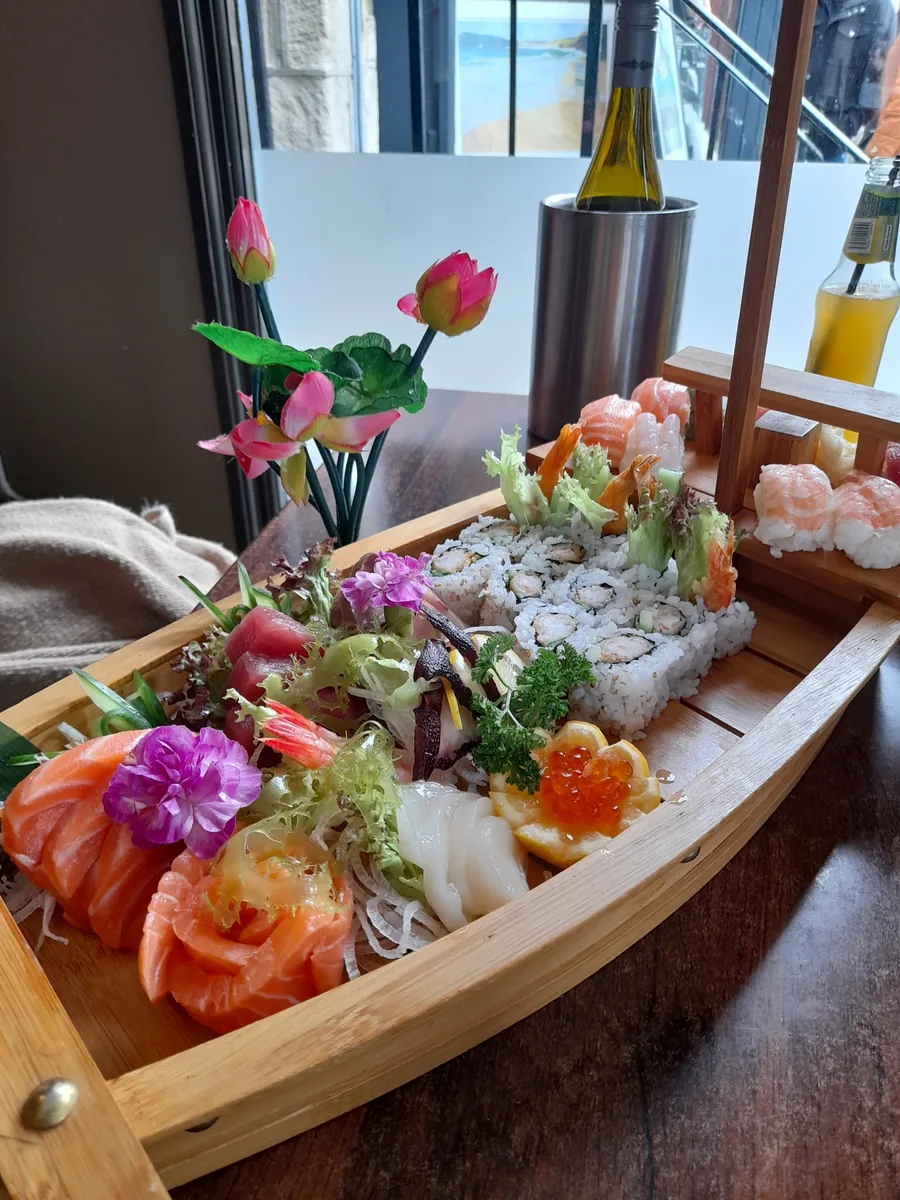 Sashimi served in a wooden boat